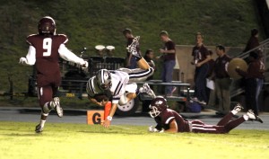 WO-S Mustang QB Jacksan Dallas (#3) leaps for a TD during first half action against the Silsbee Tigers. (Troy Jones / The Orange Leader)