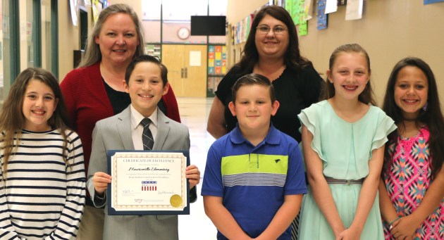 LCM Board recognizes students and outgoing Trustees Orange Leader